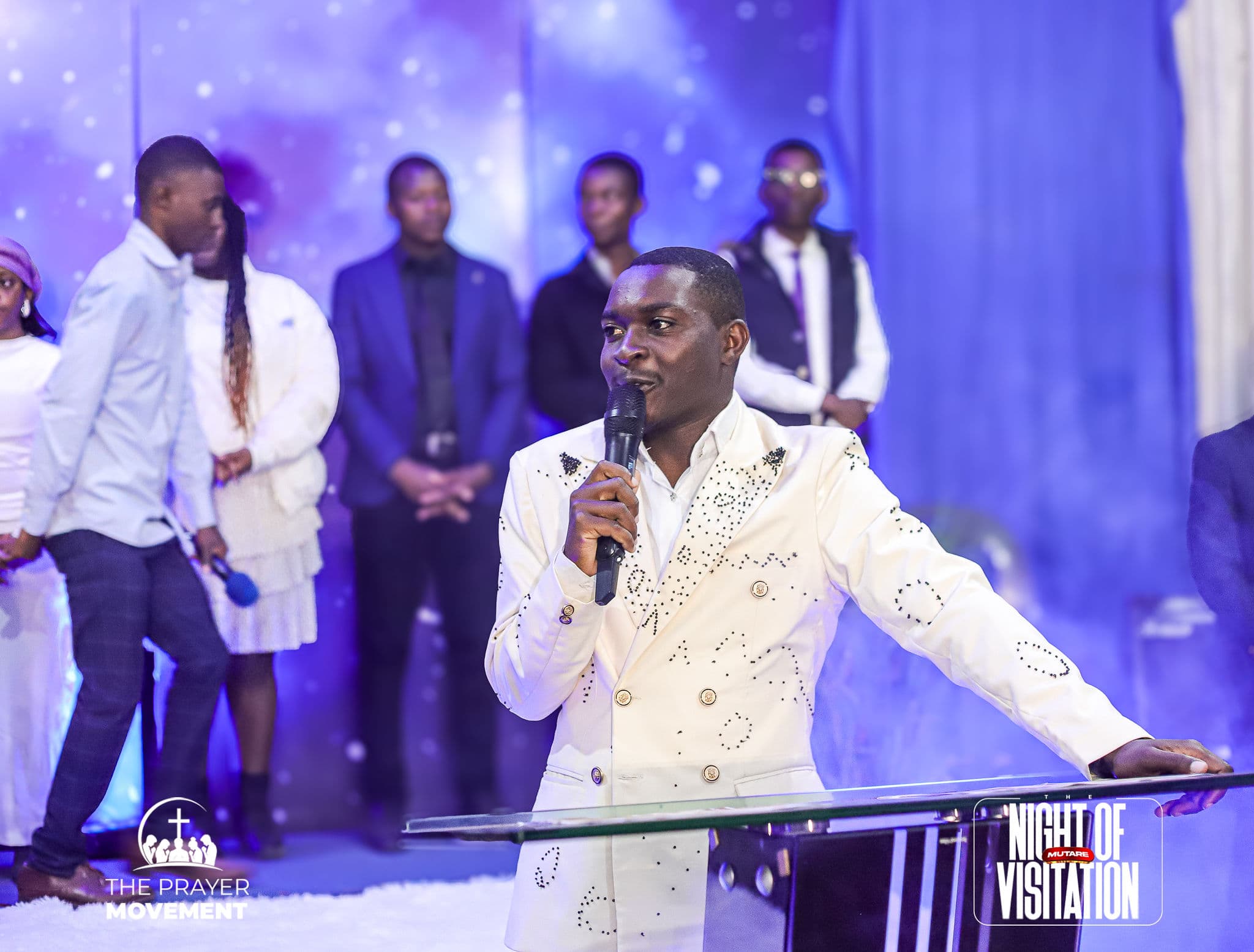 Minister preaching at the pulpit during the Night of Visitation