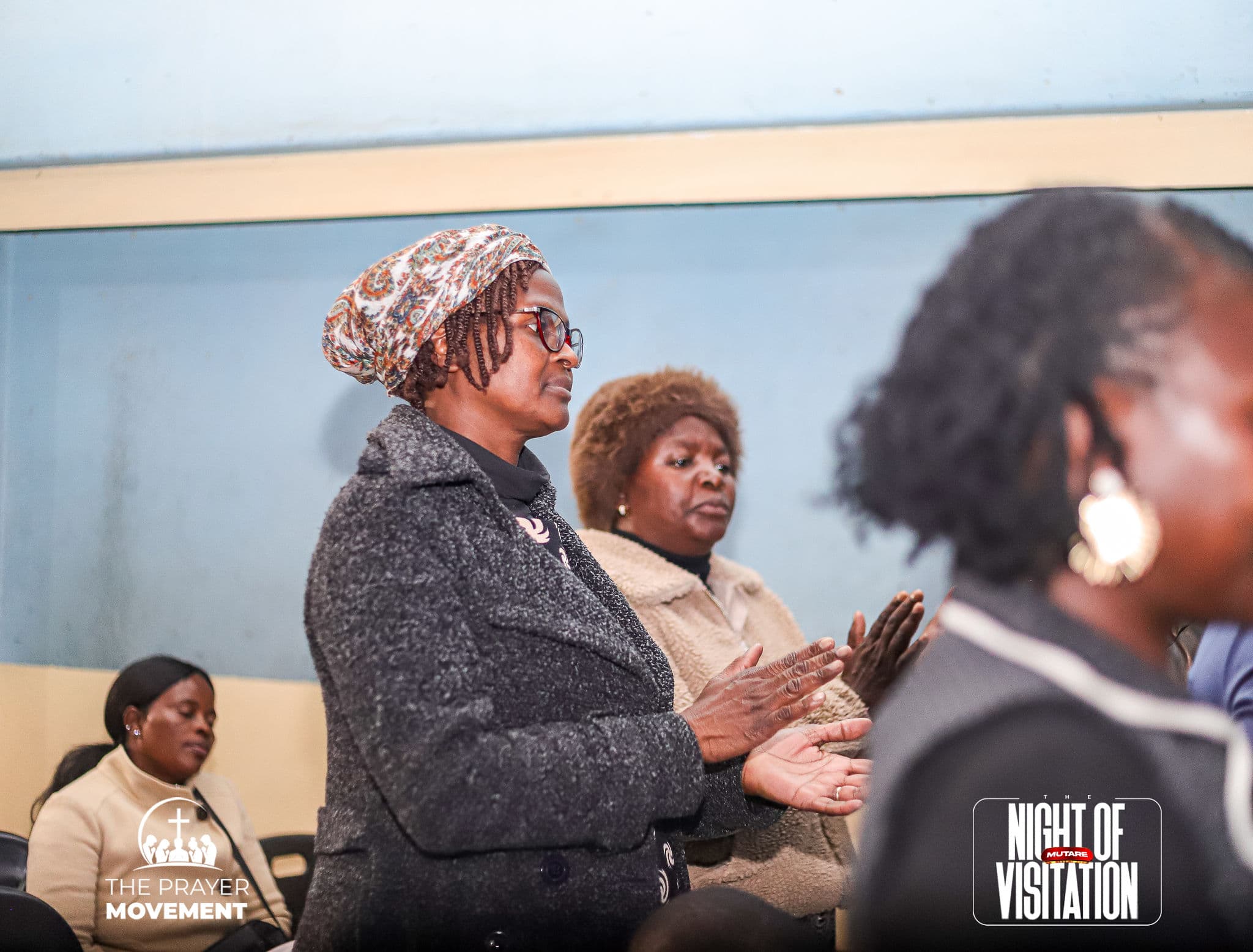 Members of the congregation in prayer