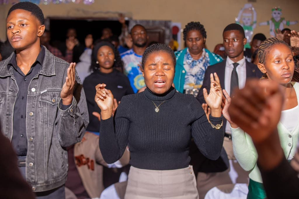 Ministers in prayer during a service
