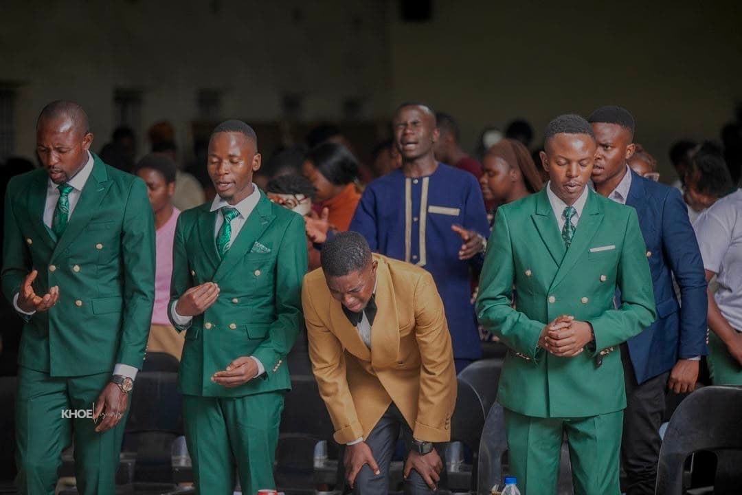 Members worshipping with raised hands